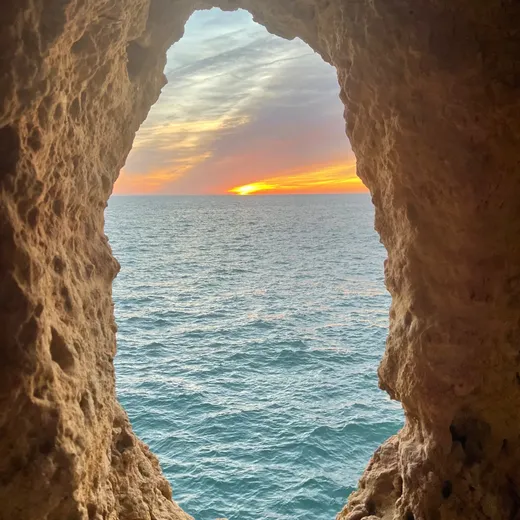 The sea seen through a window in the rocks at Algar Seco