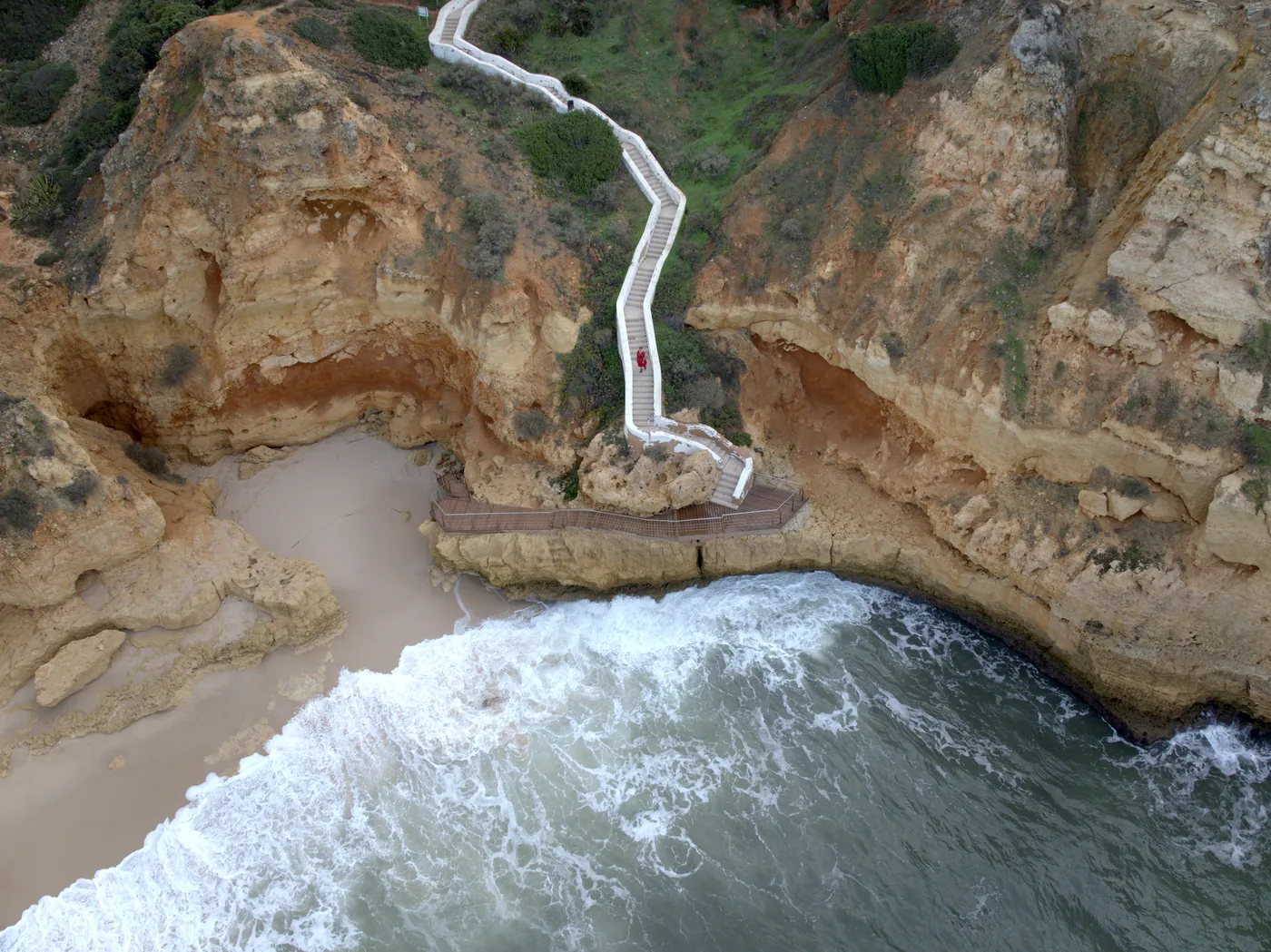 The zigzag staircase down the cliff to Praia do Paraíso seen from the air